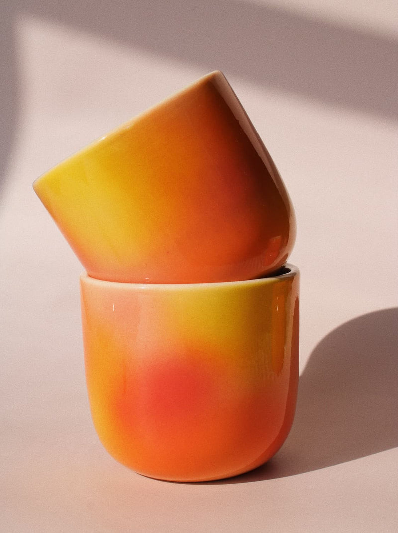Sunset Gradient Ceramic Cup by Agata Puławska – handmade ceramic cup with a warm yellow, orange and coral gradient