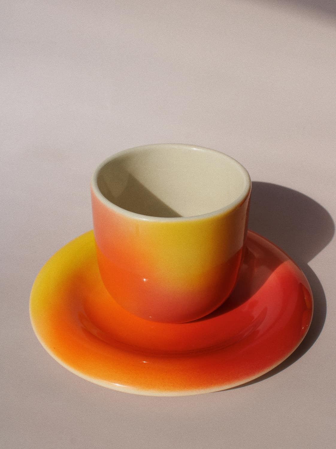 Sunset Gradient Ceramic Cup by Agata Puławska – handmade ceramic cup with a warm yellow, orange and coral gradient