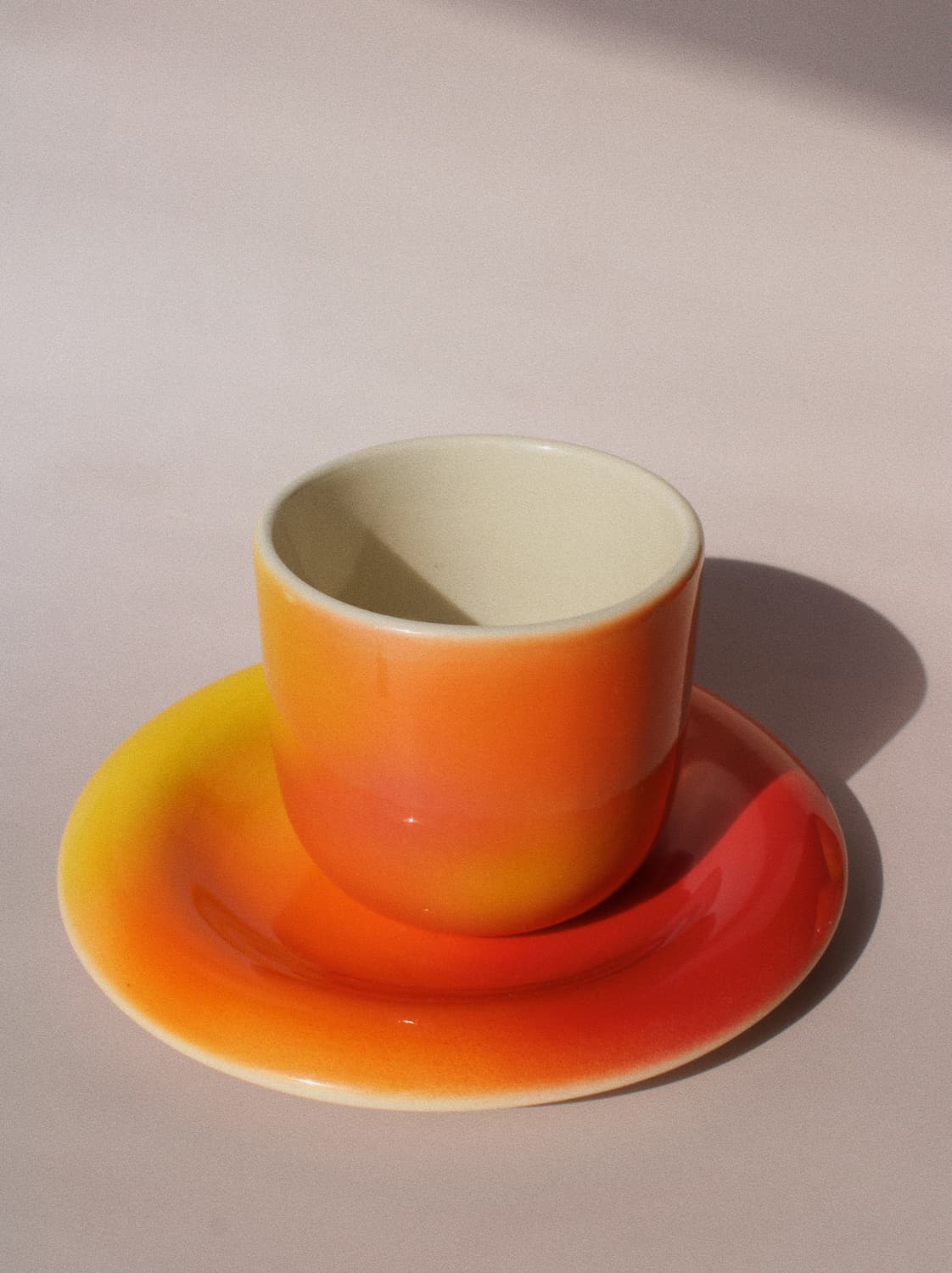 Sunset Gradient Ceramic Cup by Agata Puławska – handmade ceramic cup with a warm yellow, orange and coral gradient
