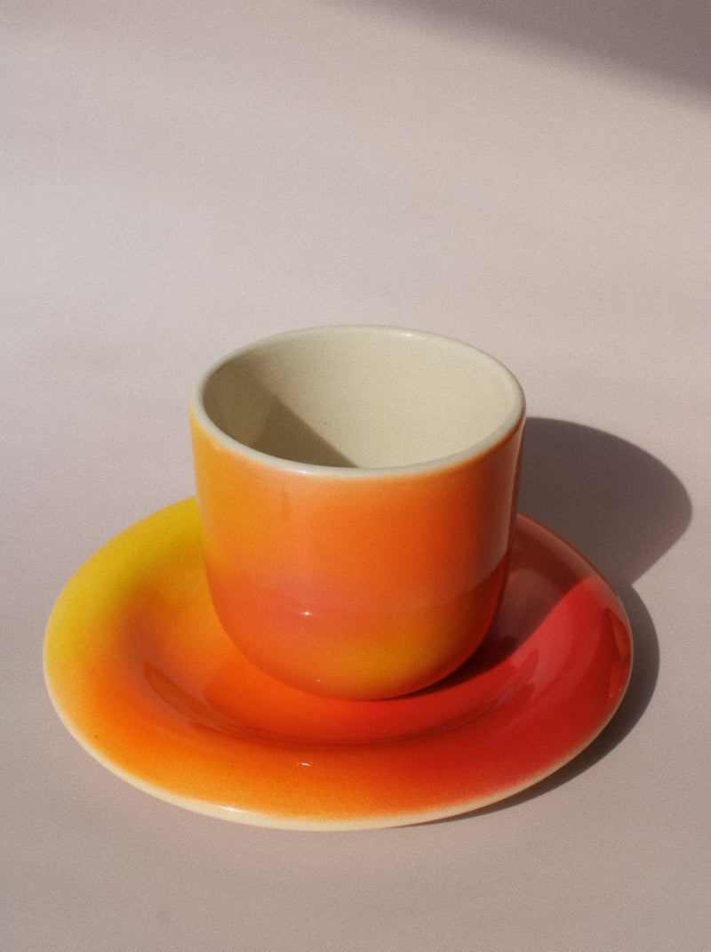 Sunset Gradient Ceramic Cup by Agata Puławska – handmade ceramic cup with a warm yellow, orange and coral gradient