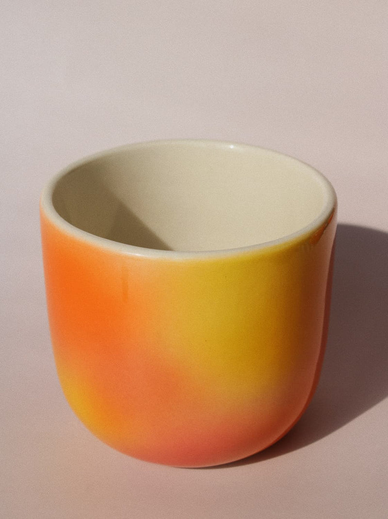 Sunset Gradient Ceramic Cup by Agata Puławska – handmade ceramic cup with a warm yellow, orange and coral gradient