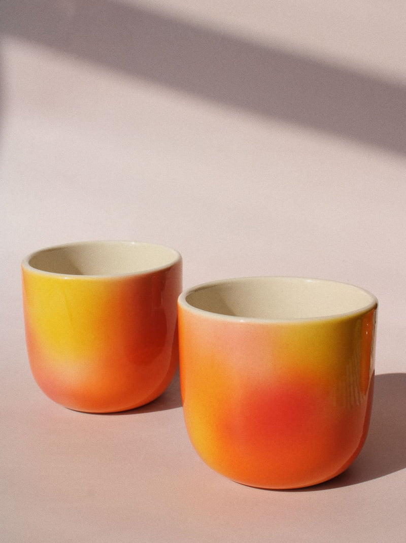 Sunset Gradient Ceramic Cup by Agata Puławska – handmade ceramic cup with a warm yellow, orange and coral gradient