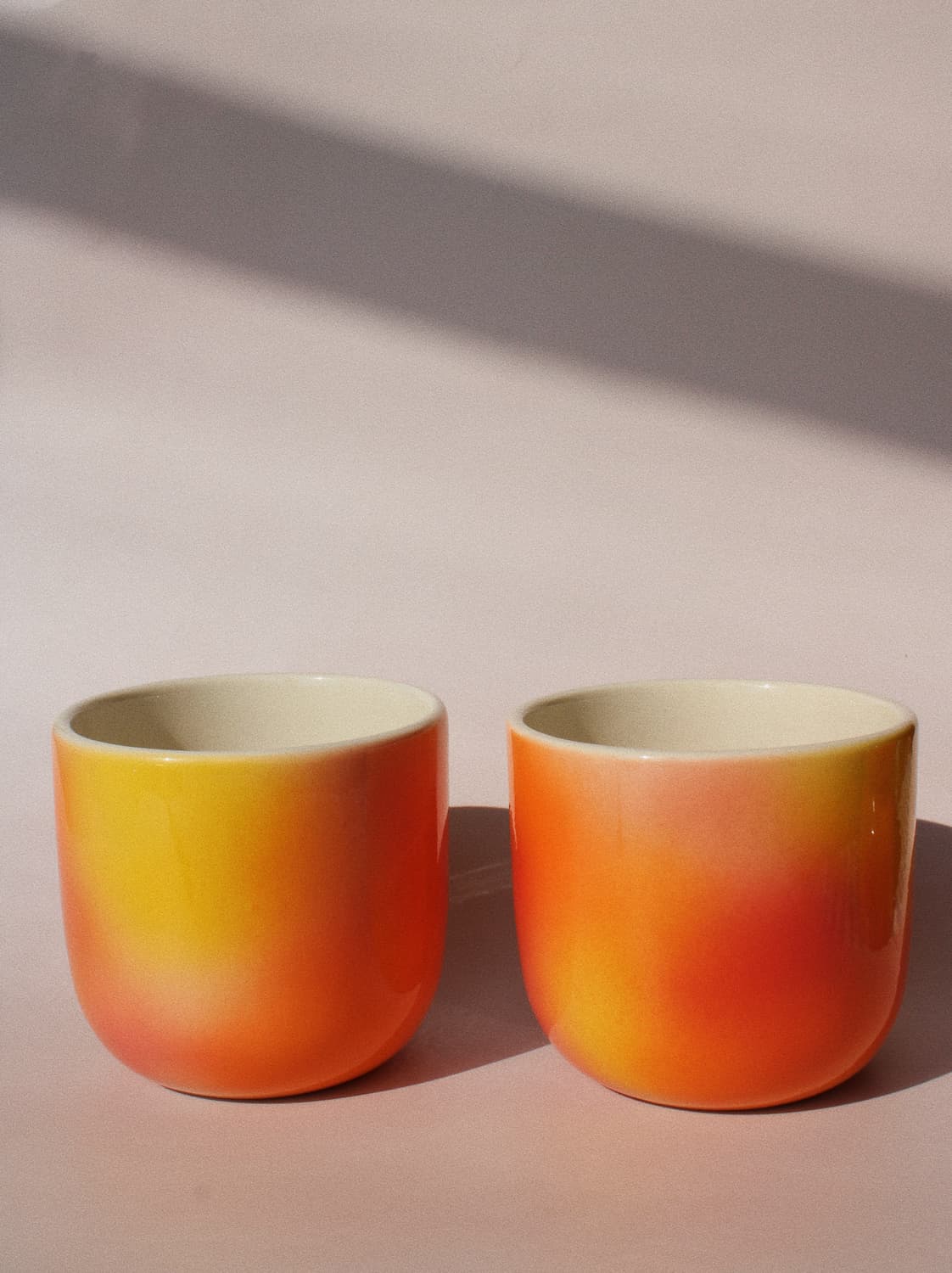Sunset Gradient Ceramic Cup by Agata Puławska – handmade ceramic cup with a warm yellow, orange and coral gradient