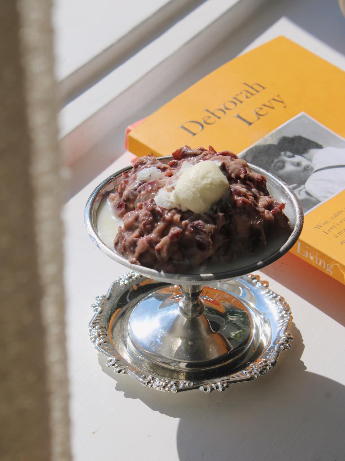 Lacey Silver dessert plate and pedestal stand with ornate filigree rim detail, styled with chocolate dessert and vanilla ice cream