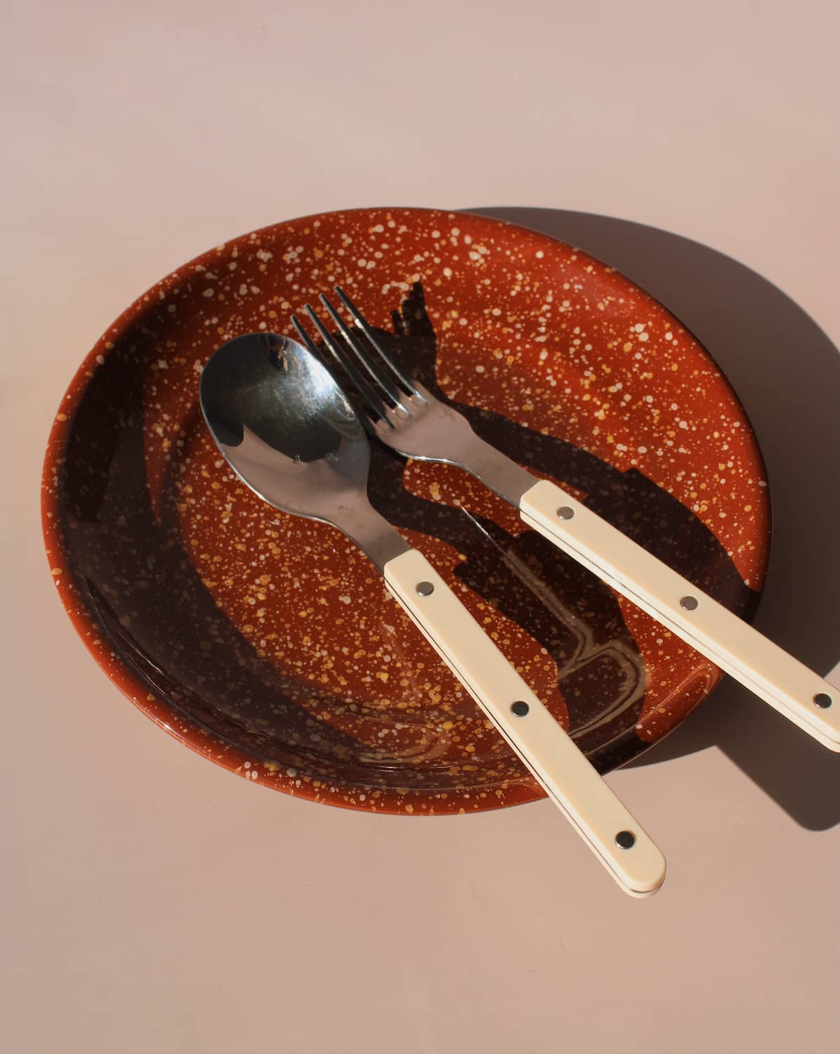 Roca ceramic plate with warm terracotta glaze and speckled finish, handmade stoneware plate for modern table settings.