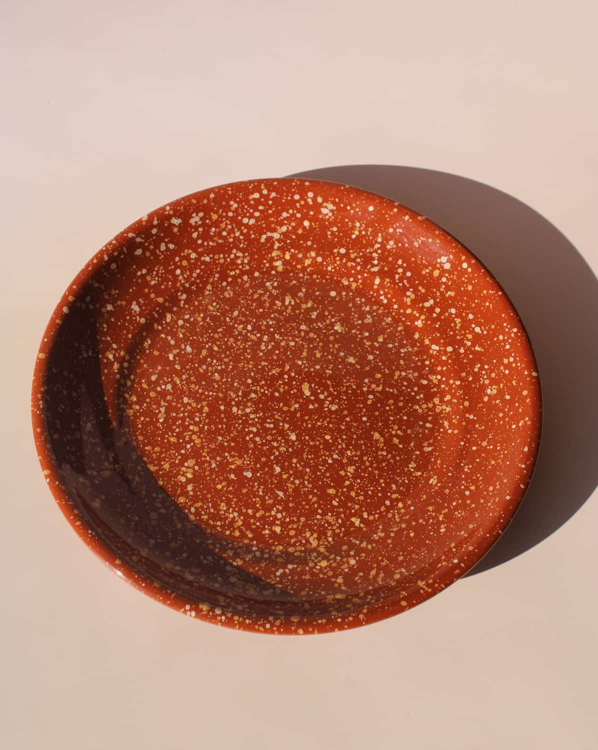 Roca ceramic plate with warm terracotta glaze and speckled finish, handmade stoneware plate for modern table settings.
