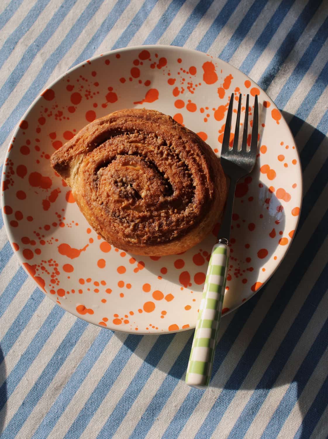Corra ceramic plate with pastry handmade orange splatter dessert plate aesthetic breakfast setting