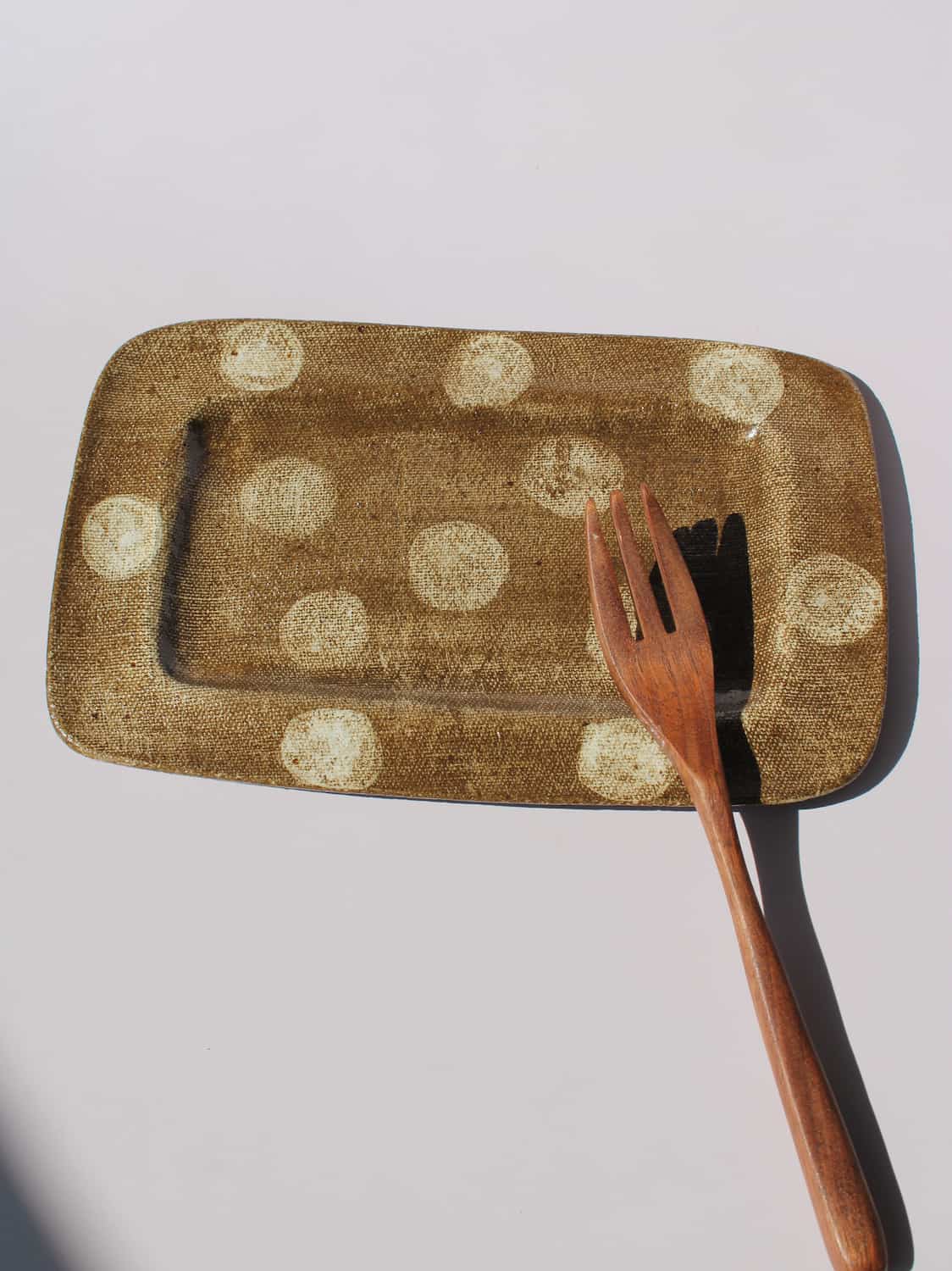 Biscotti Ceramic Plate in brown with ivory polka dots, rectangular handmade ceramic serving plate top view