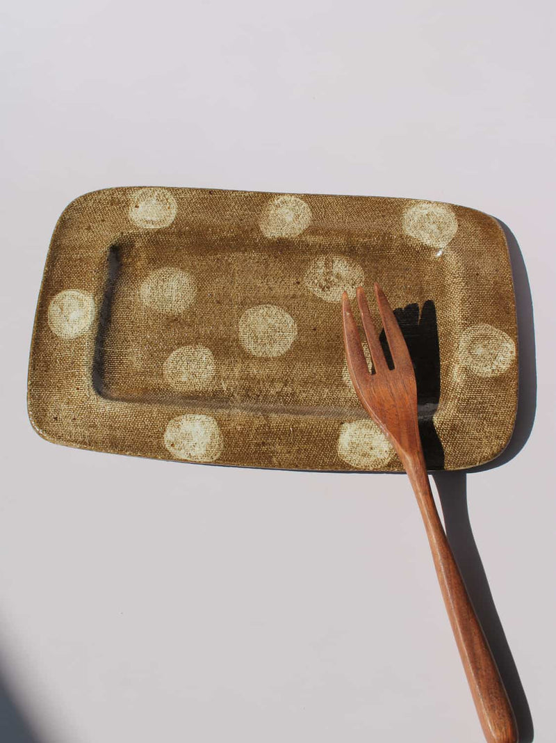 Biscotti Ceramic Plate in brown with ivory polka dots, rectangular handmade ceramic serving plate top view