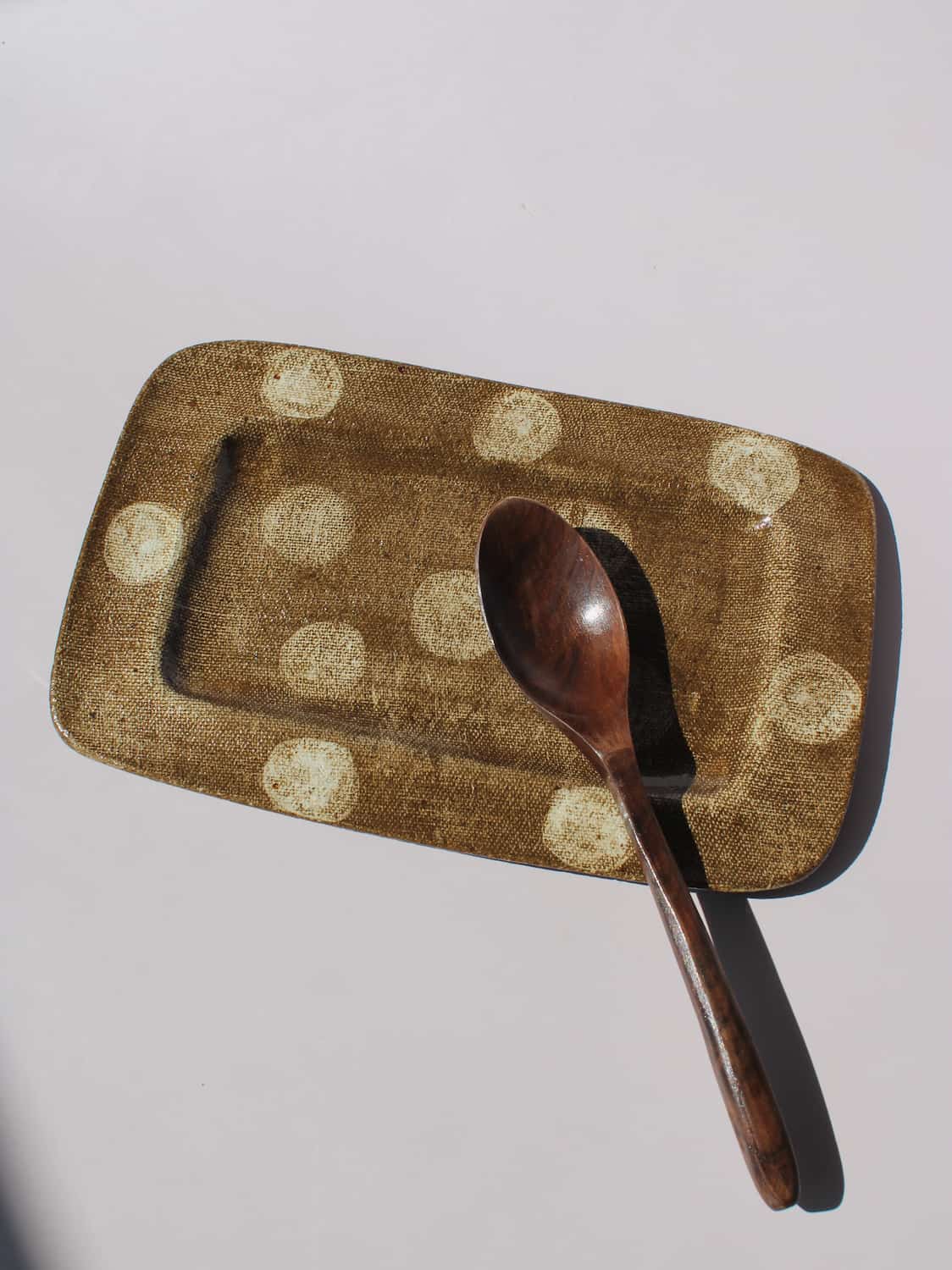 Biscotti Ceramic Plate in brown with ivory polka dots, rectangular handmade ceramic serving plate top view
