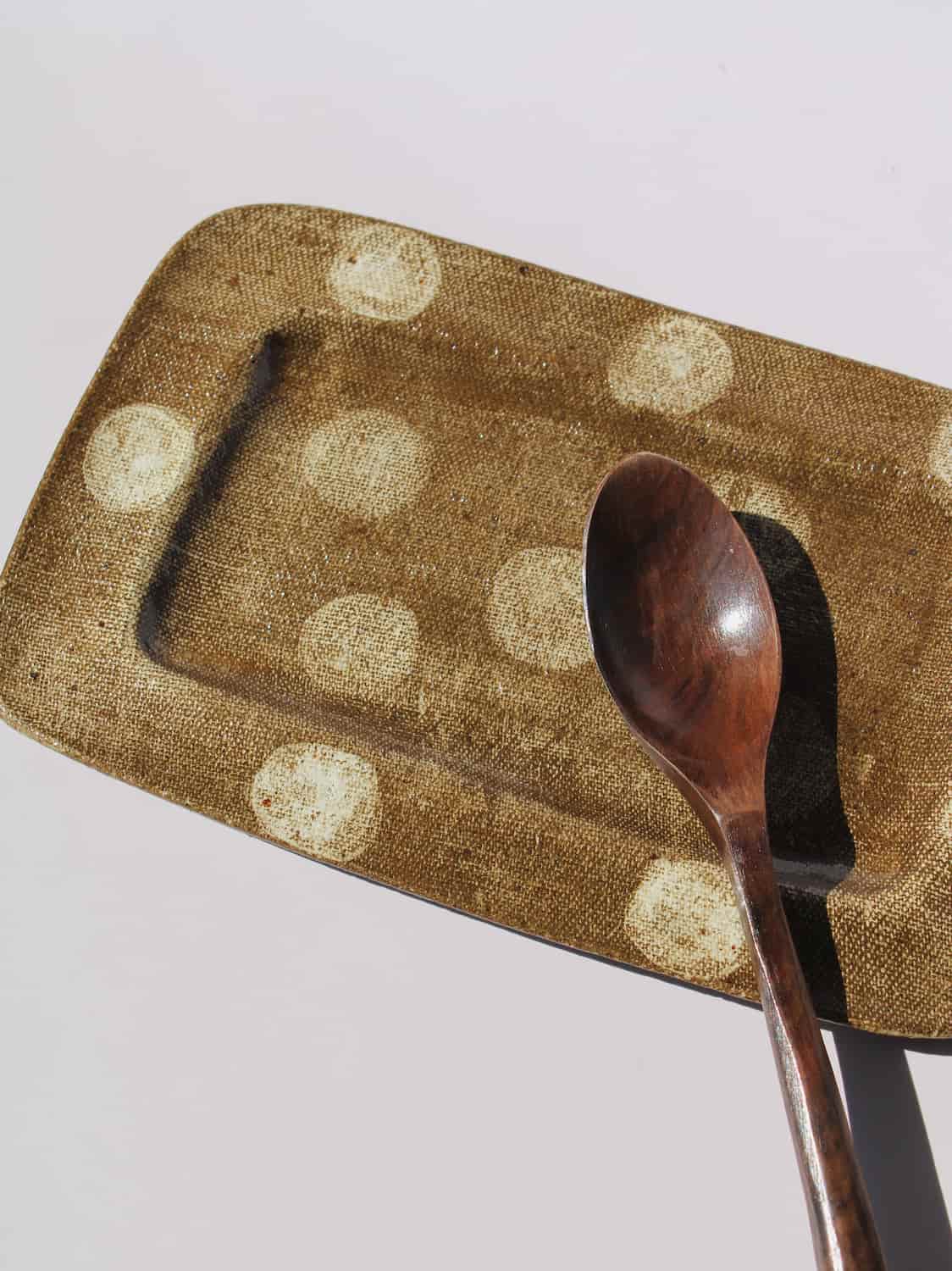 Biscotti Ceramic Plate in brown with ivory polka dots, rectangular handmade ceramic serving plate top view