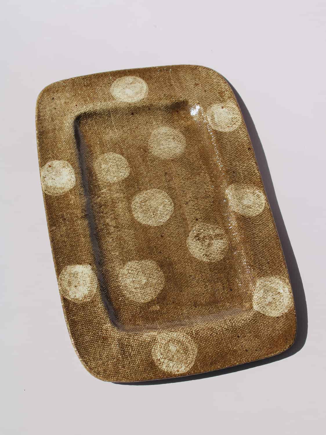 Biscotti Ceramic Plate in brown with ivory polka dots, rectangular handmade ceramic serving plate top view