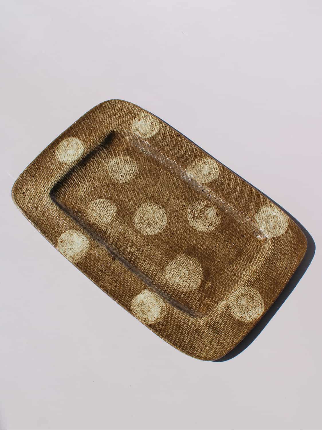 Biscotti Ceramic Plate in brown with ivory polka dots, rectangular handmade ceramic serving plate top view