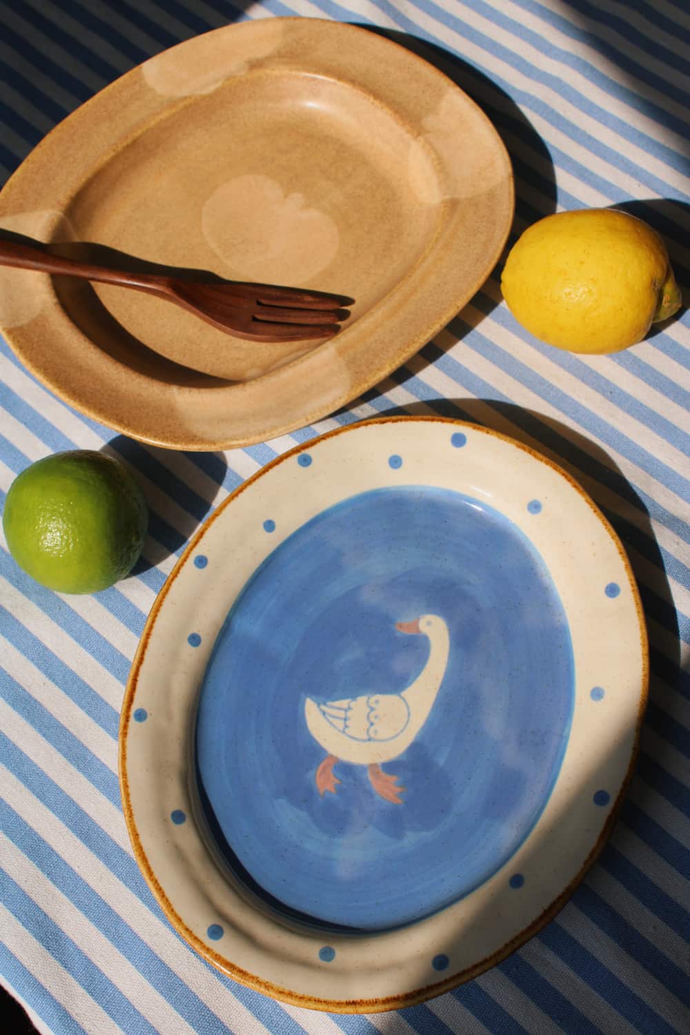 Blue ceramic Pond plate with duck motif and Pom plate with fruit design, handmade plates for snacks and table styling