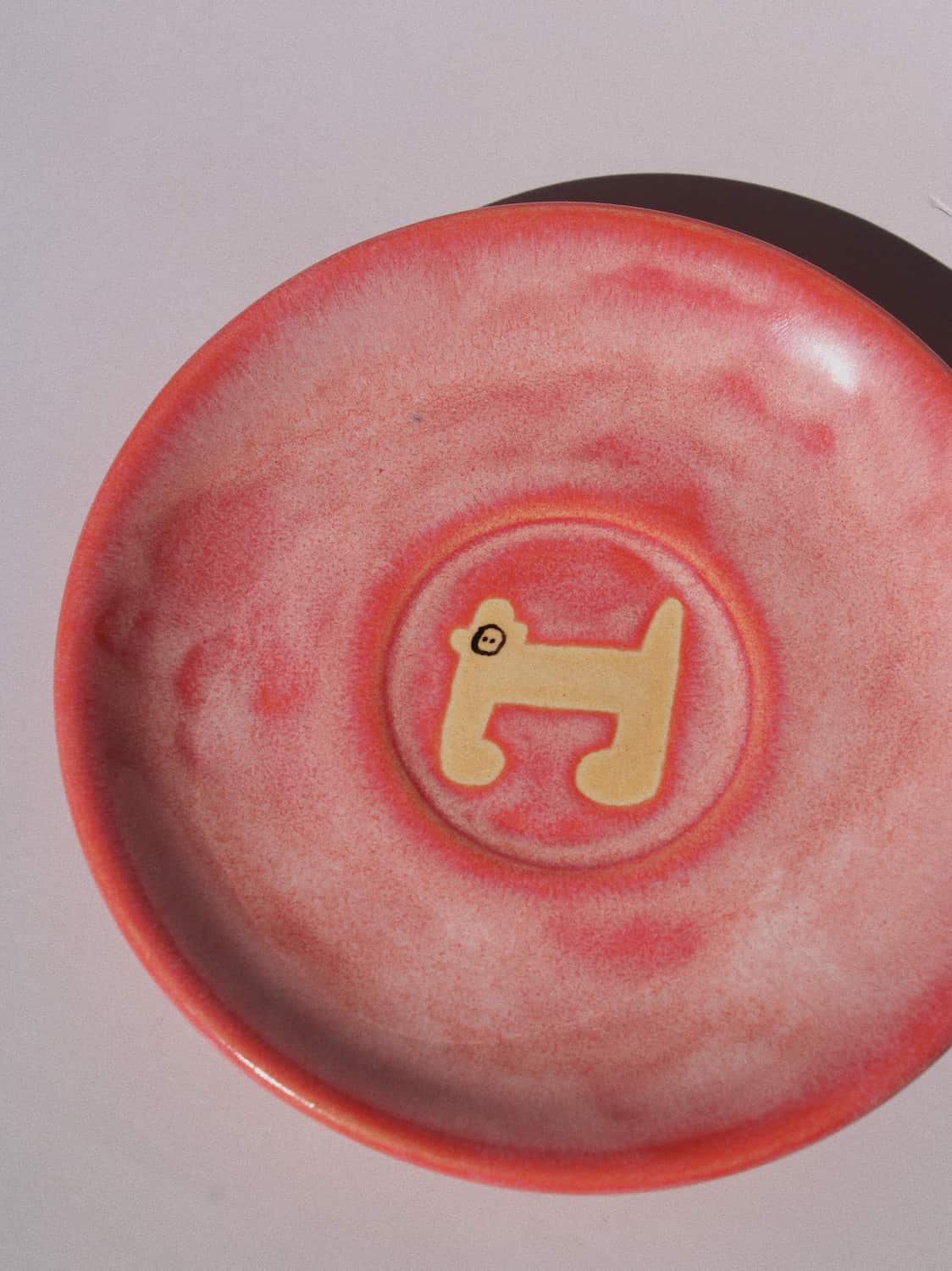 Candy Monkey Ceramic Plate by Marta Shurpakova – handmade pink ceramic plate with a playful monkey design