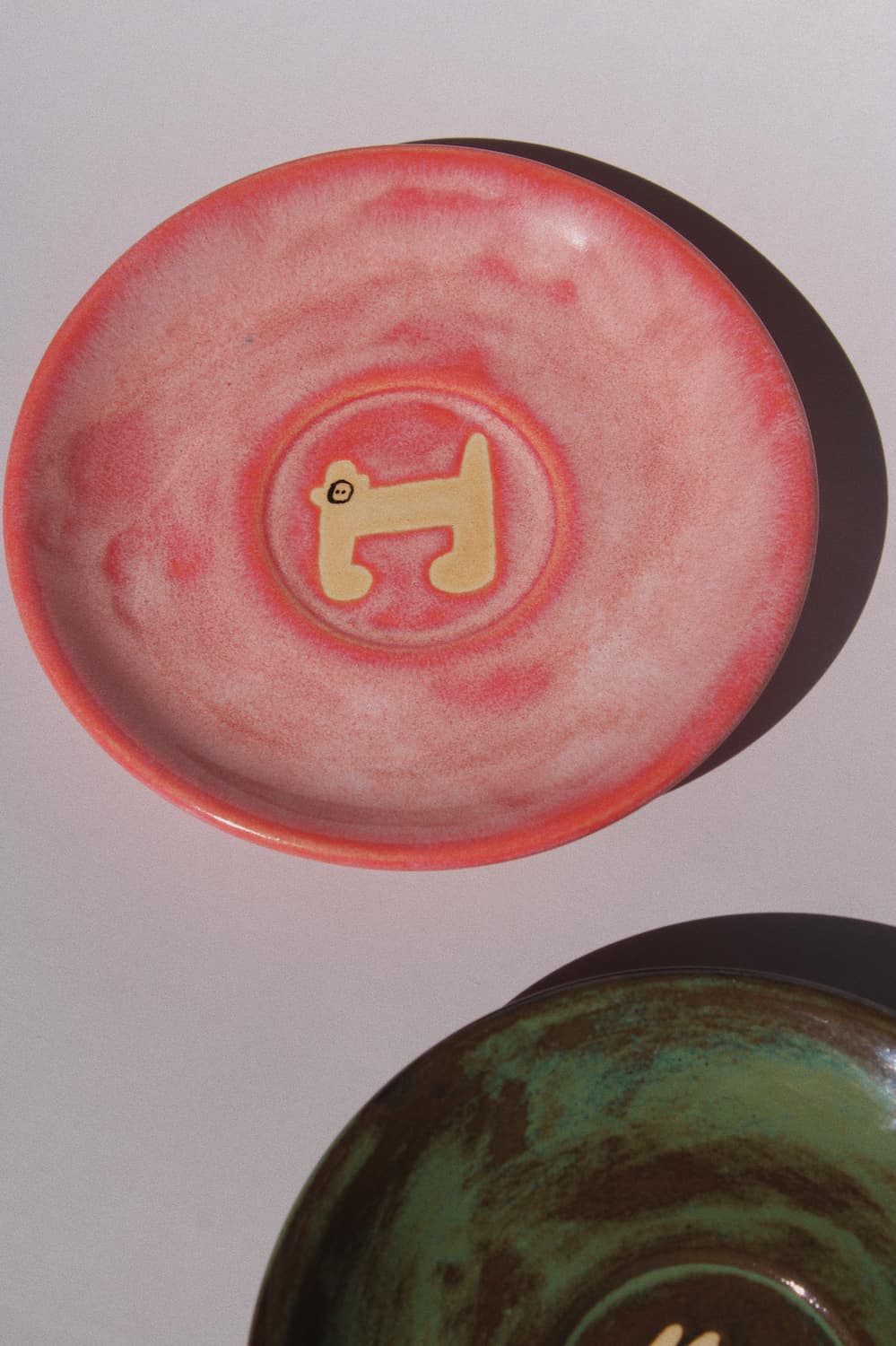 Candy Monkey Ceramic Plate by Marta Shurpakova – handmade pink ceramic plate with a playful monkey design
