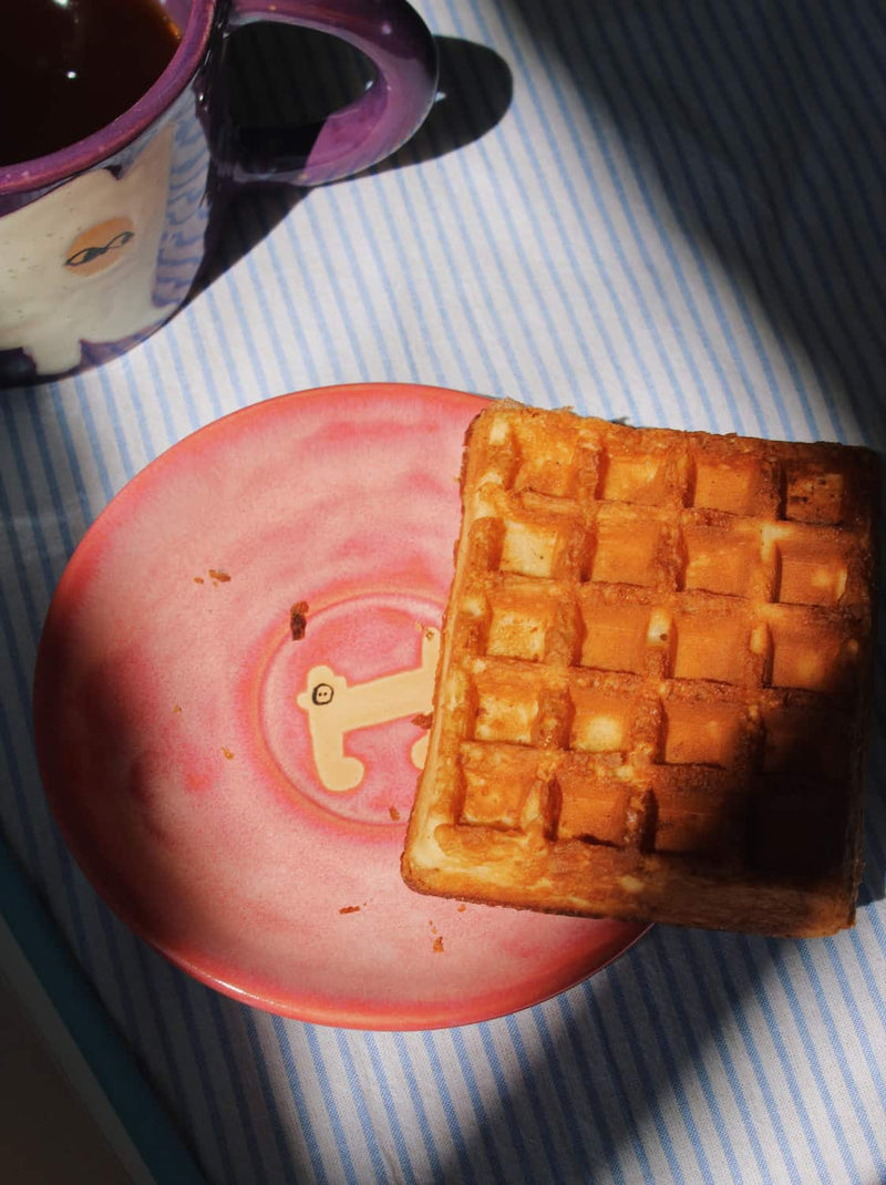 Candy Monkey Ceramic Plate by Marta Shurpakova – handmade pink ceramic plate with a playful monkey design, styled for everyday tableware