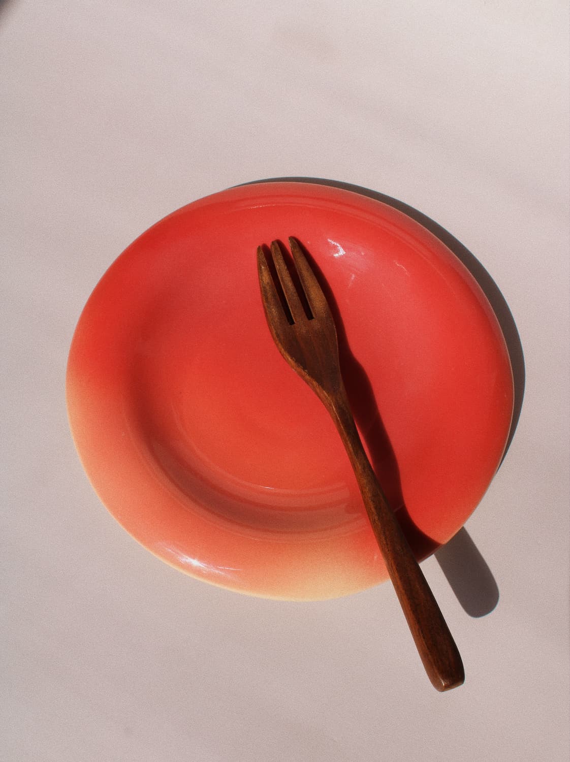 Belly Poppy Ceramic Plate by Agata Puławska – handmade ceramic plate in a rich poppy red glaze with a glossy finish