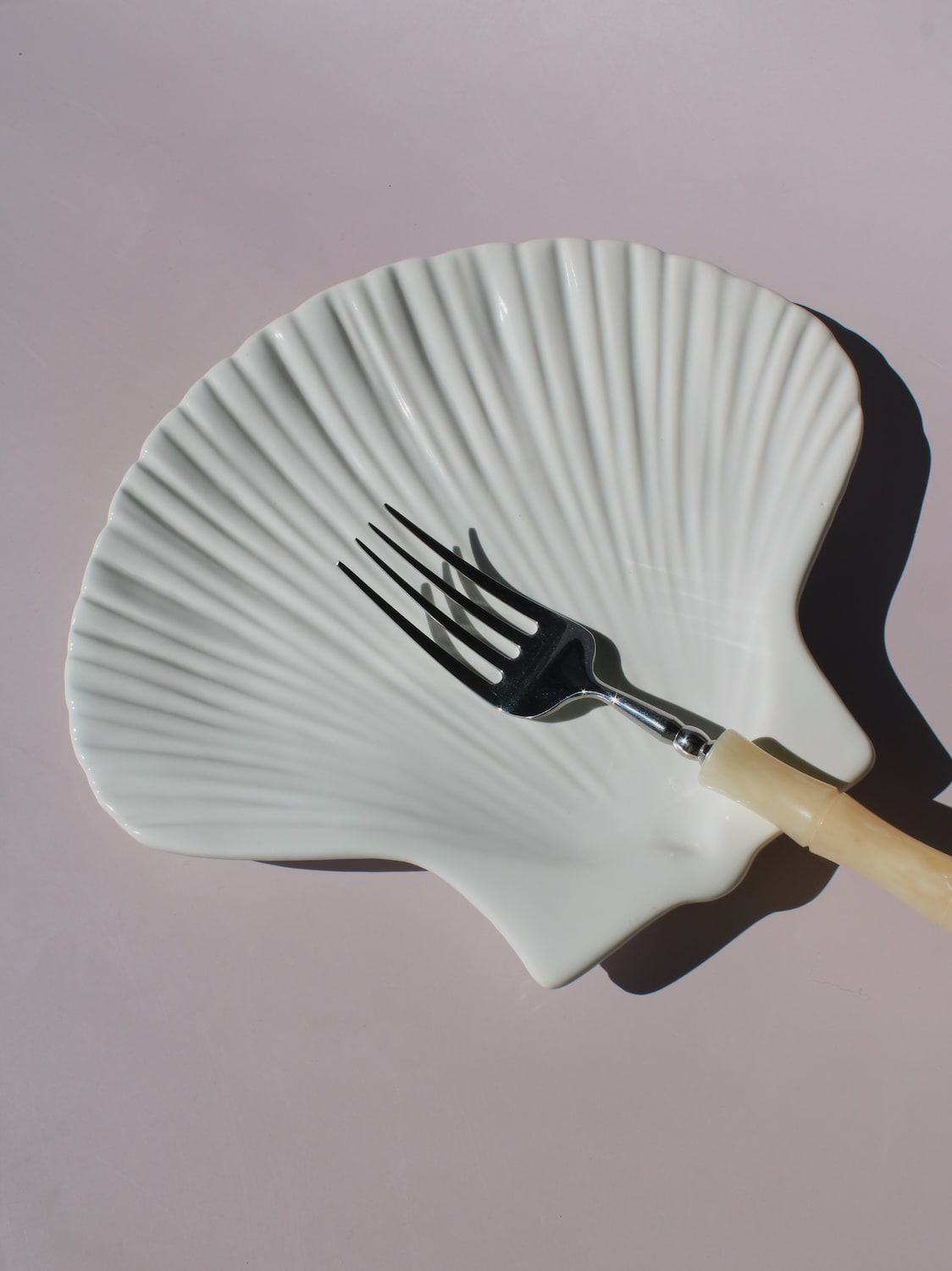 Calista Ceramic Shell Plate in white scallop shell shape with ribbed fan texture, handmade ceramic trinket plate
