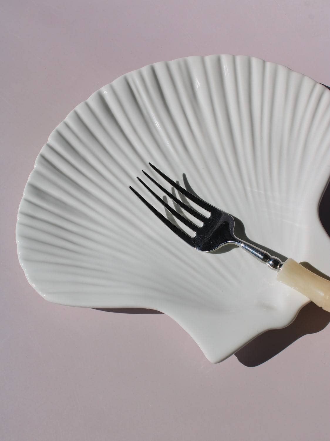 Calista Ceramic Shell Plate in white scallop shell shape with ribbed fan texture, handmade ceramic trinket plate