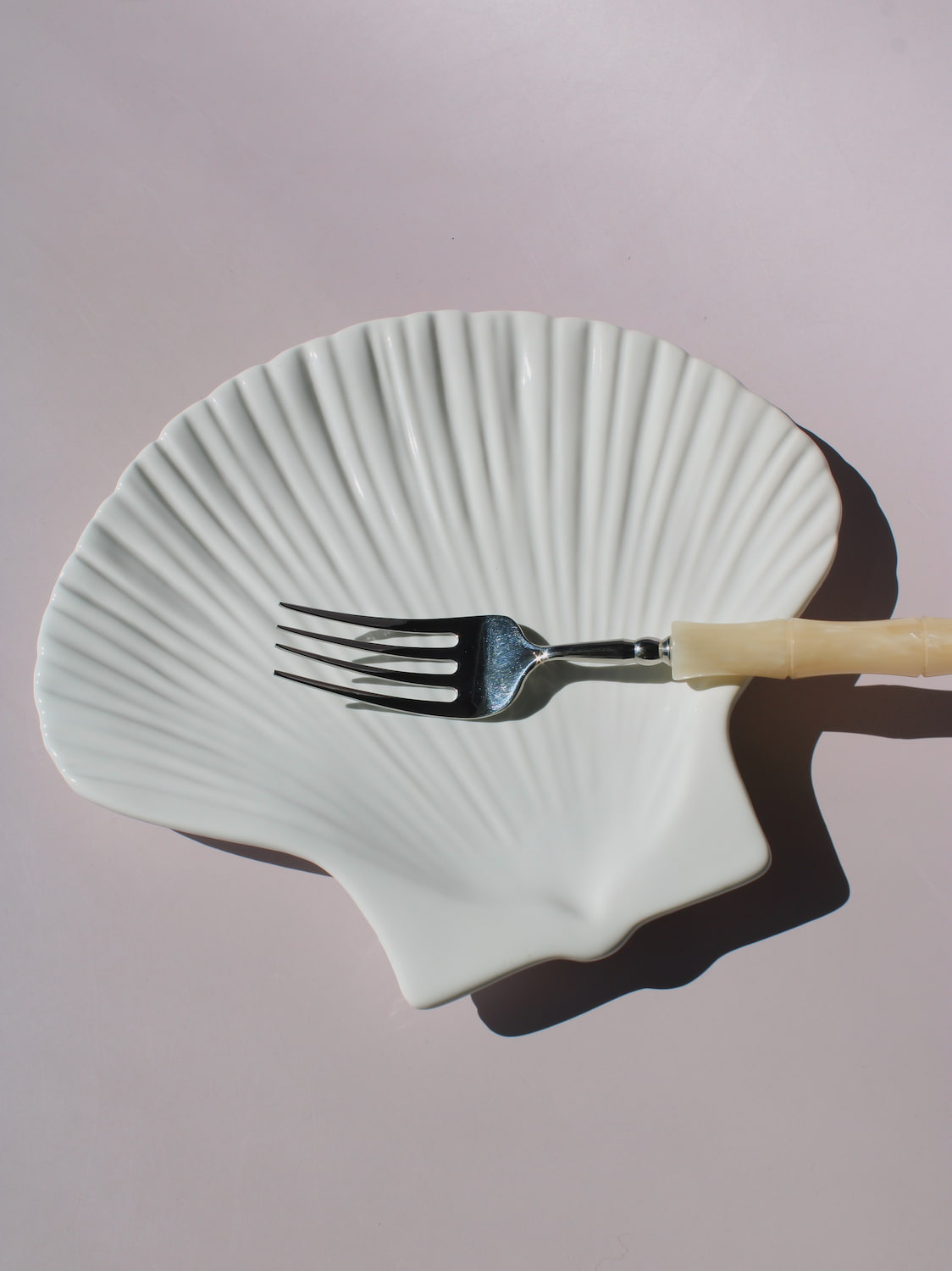 Calista Ceramic Shell Plate in white scallop shell shape with ribbed fan texture, handmade ceramic trinket plate