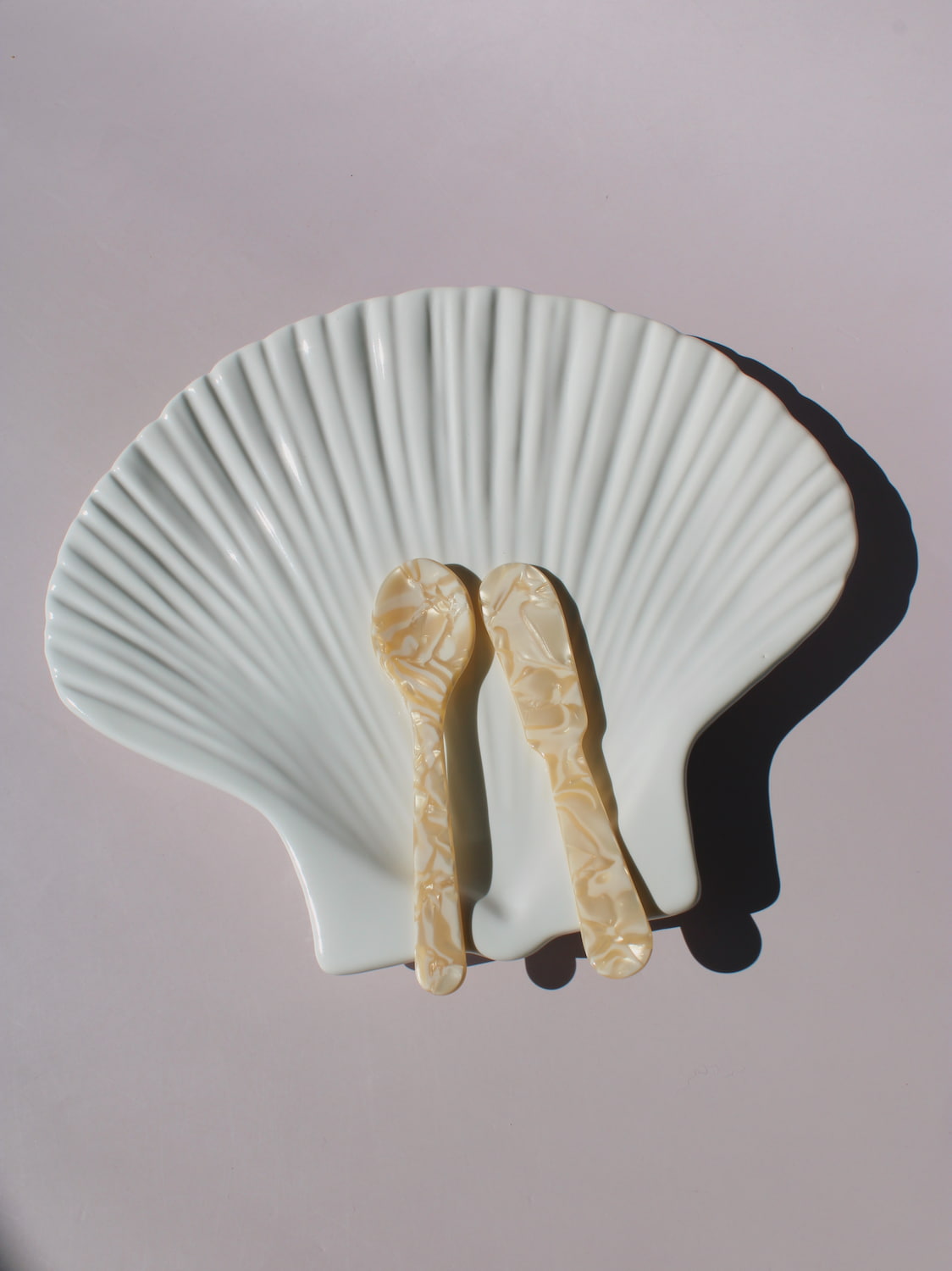 Calista Ceramic Shell Plate in white scallop shell shape with ribbed fan texture, handmade ceramic trinket plate
