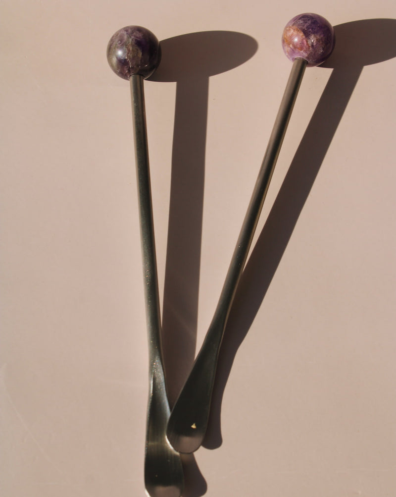 Astra Stone Stirrer collection featuring Nebula, Aster, Amethyst, and Ember stone drink stirrers in sculptural barware design.