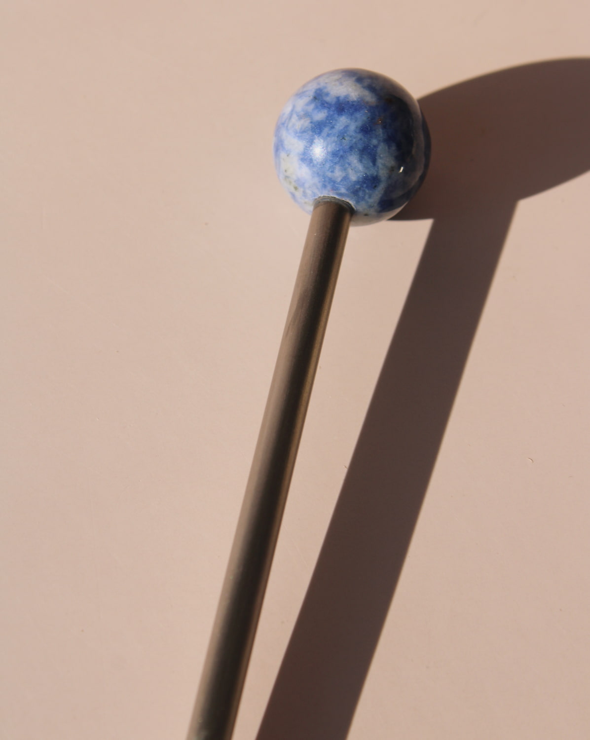 Aster Astra Stone Stirrer with deep blue stone sphere, elegant drink stirrer for cocktails, coffee, or matcha rituals.