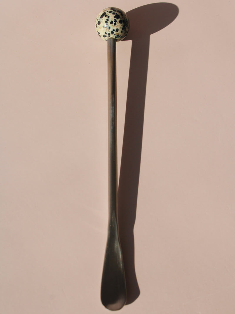 Nebula Astra Stone Stirrer with black and white speckled stone top, sculptural drink stirrer for cocktails, coffee, or matcha.
