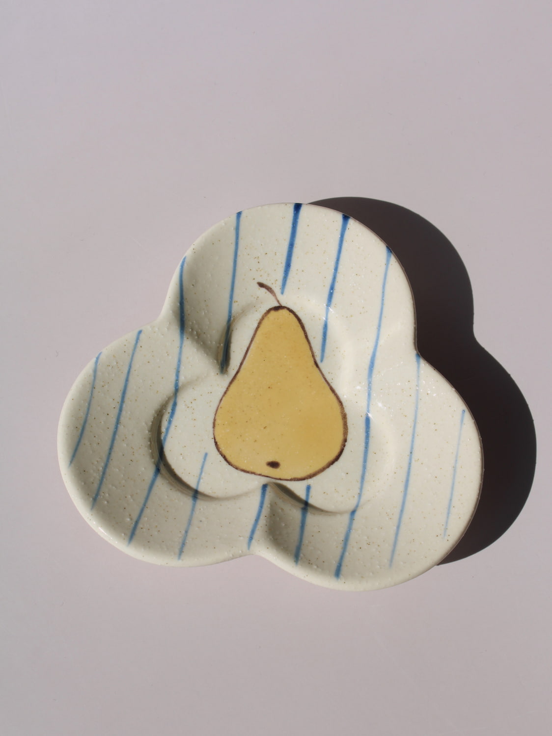 Poire Ceramic Saucer Dish in clover shape with hand-painted pear illustration and blue stripes, handmade ceramic trinket dish