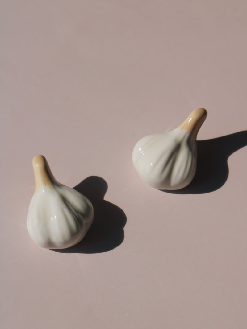 Garlic Ceramic Chopstick Rest Set shaped like garlic cloves with golden brown stems, handmade ceramic