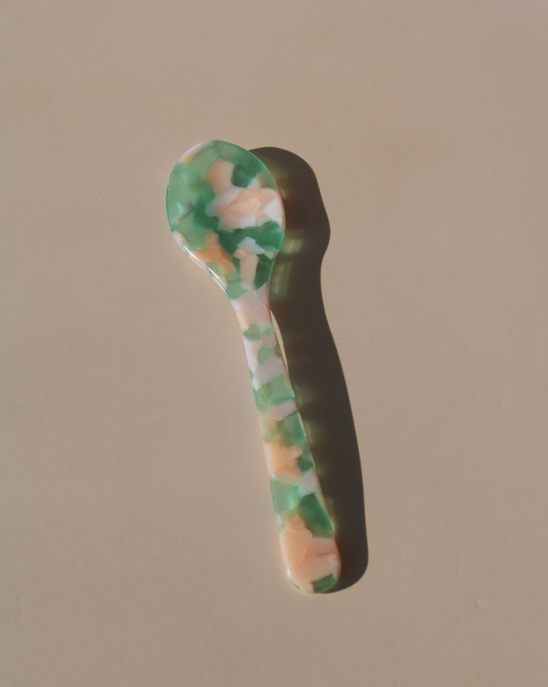 Green and peach marbled acrylic spoons, handmade-look resin dessert spoons for stylish table settings.