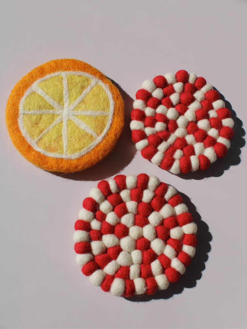 Clementine and Bonbon Handmade Coasters together, felted wool citrus-slice and candy-stripe coaster set