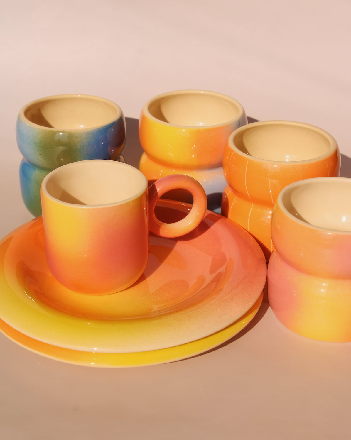 handmade ceramic coffee cup collection by Agata Puławska colorful espresso cups and mugs in gradient glazes