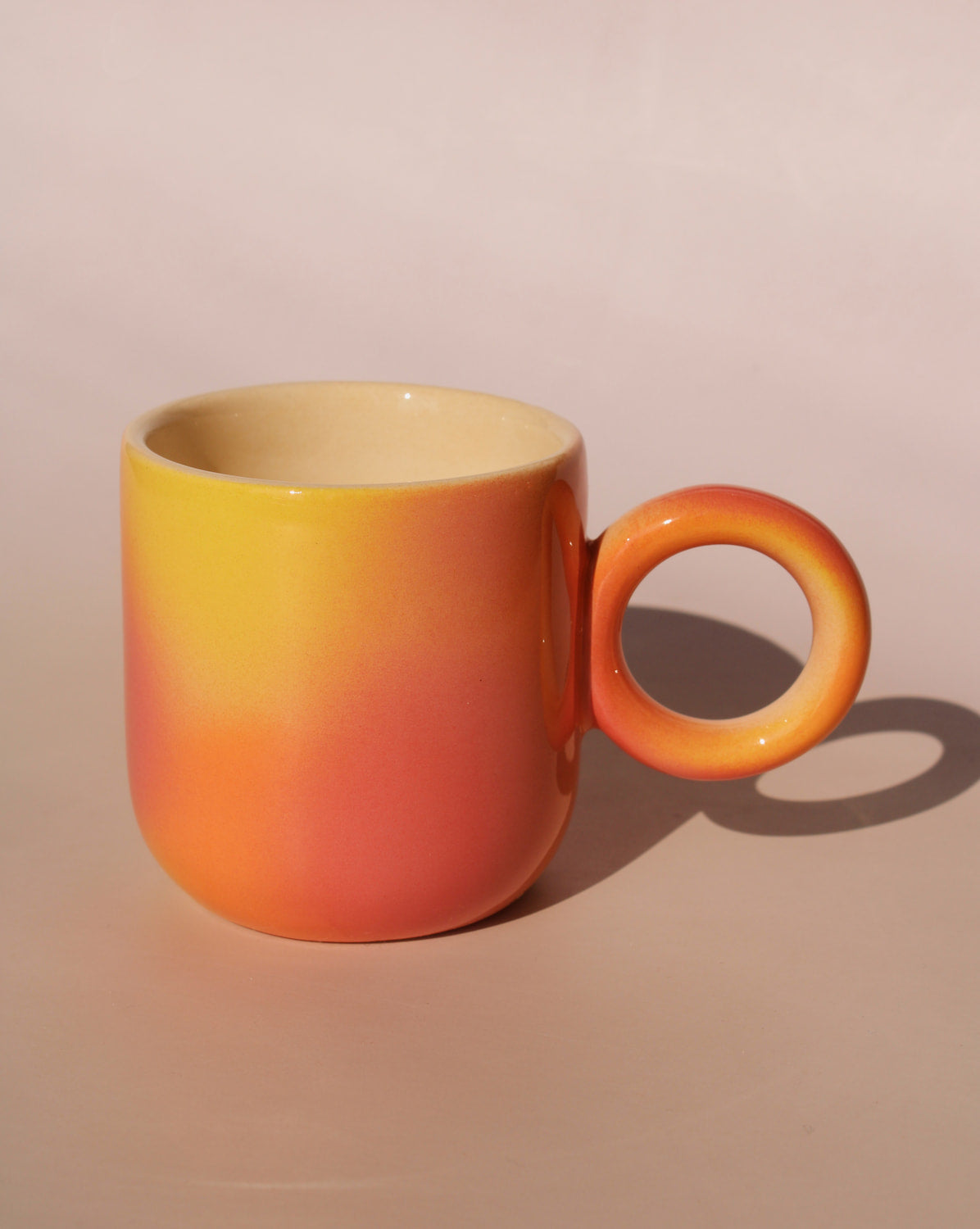handmade ceramic espresso cup in sunset gradient orange and yellow by Agata Puławska small coffee cup