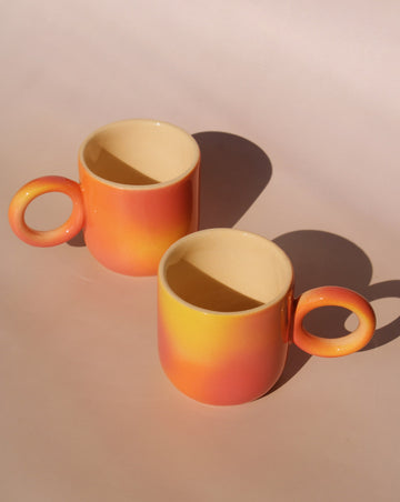 two handmade ceramic espresso cups in gradient orange yellow glaze artisan coffee cups by Agata Puławska