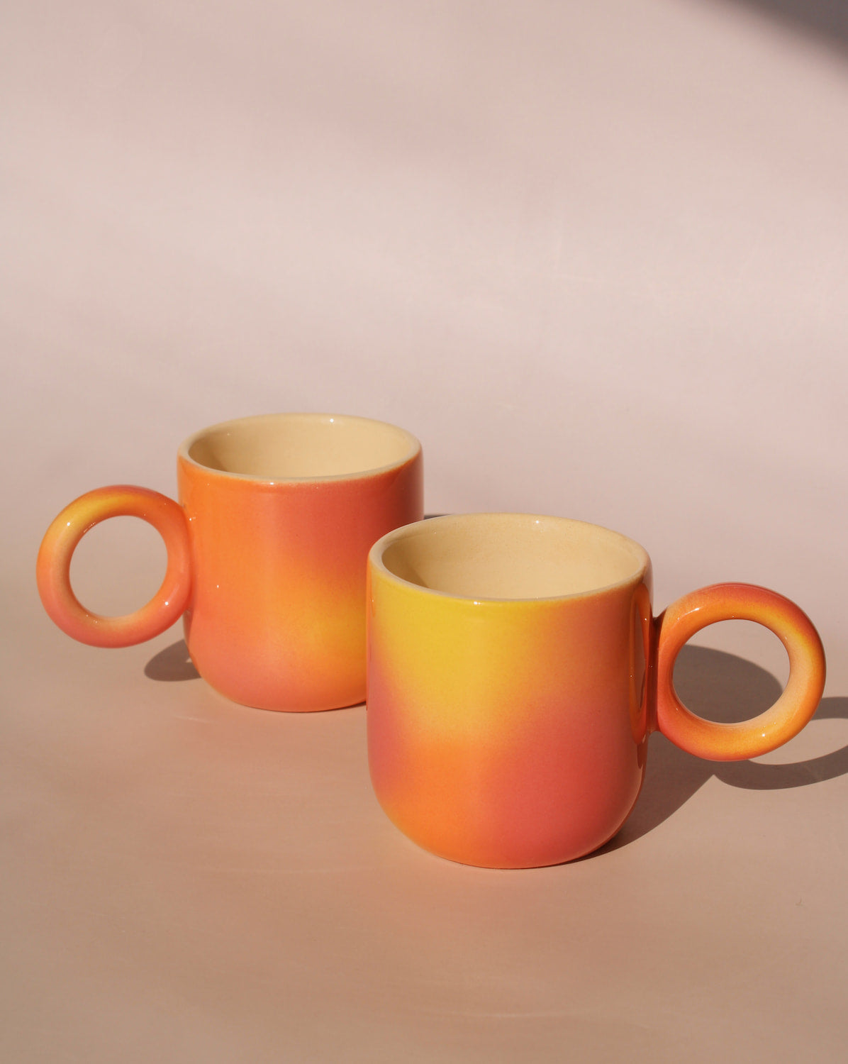 two handmade ceramic espresso cups in gradient orange yellow glaze artisan coffee cups by Agata Puławska