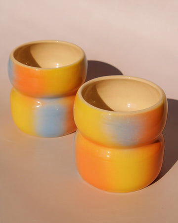 two Belly Summertime ceramic mugs by Agata Puławska handmade colorful coffee cups in soft gradient glaze
