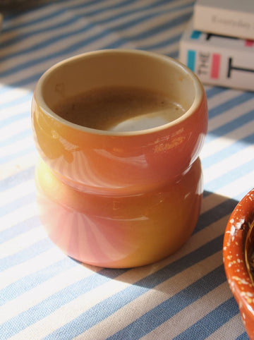 Belly sunset ceramic mug with soft gradient glaze in warm tones, handcrafted coffee cup for everyday use