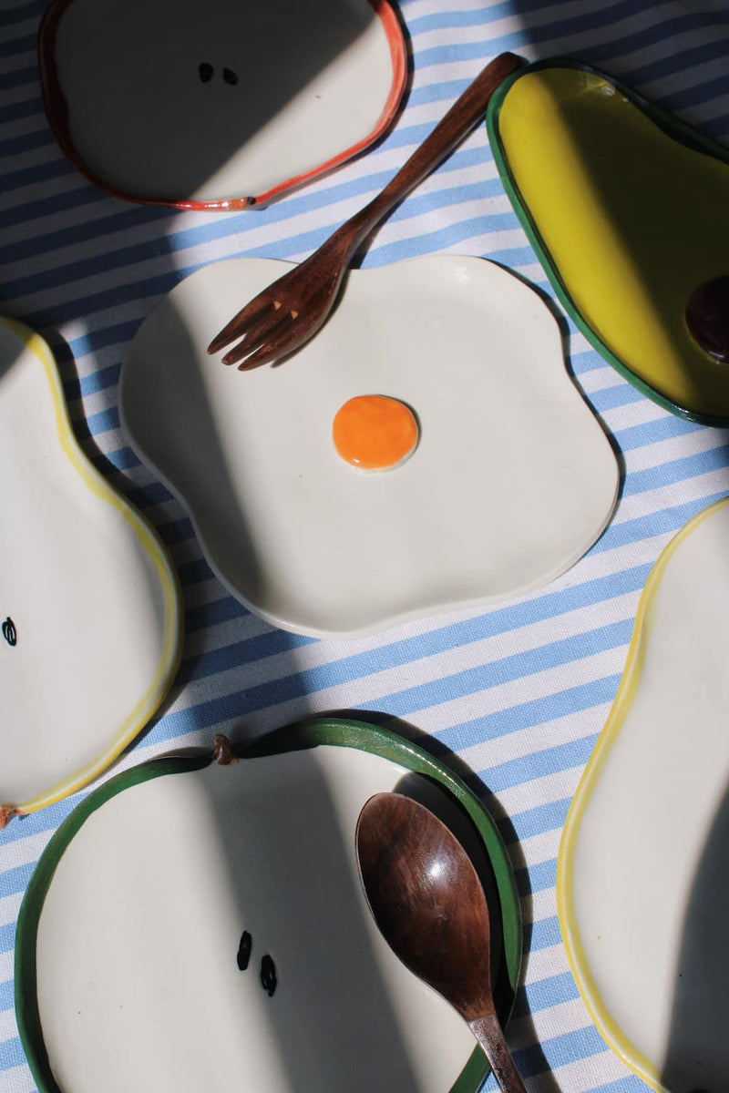 Handmade ceramic egg spoon rest for breakfast table, small kitchen accessory for eggs, spoons, and table styling.