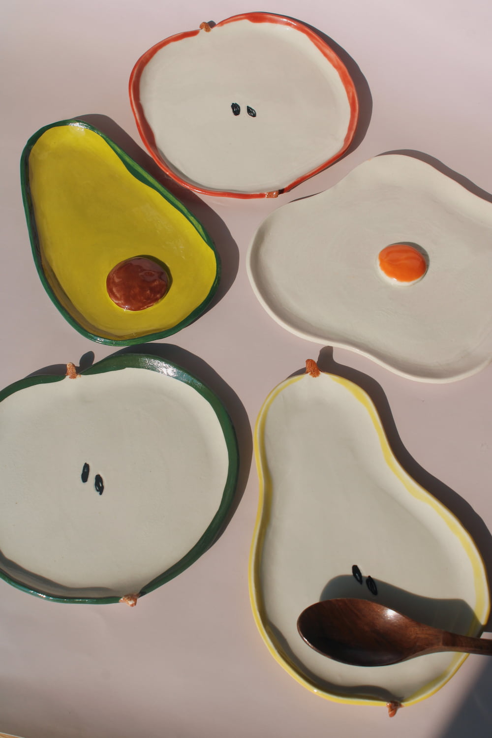 handmade ceramic fruit plates and spoon rests apple pear avocado egg playful kitchen ceramics set