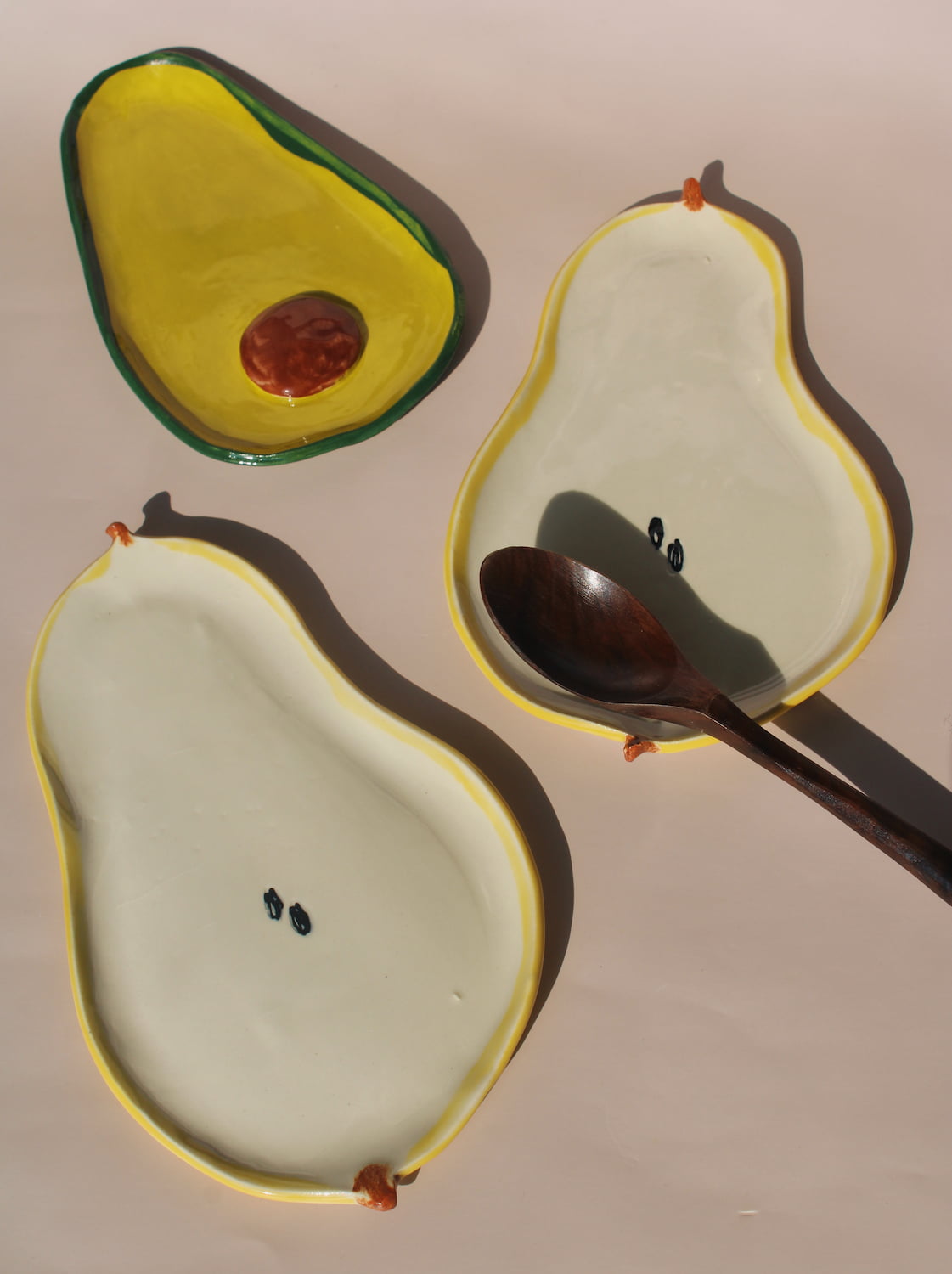handmade ceramic avocado spoon rest with fruit shaped plates playful kitchen ceramics set