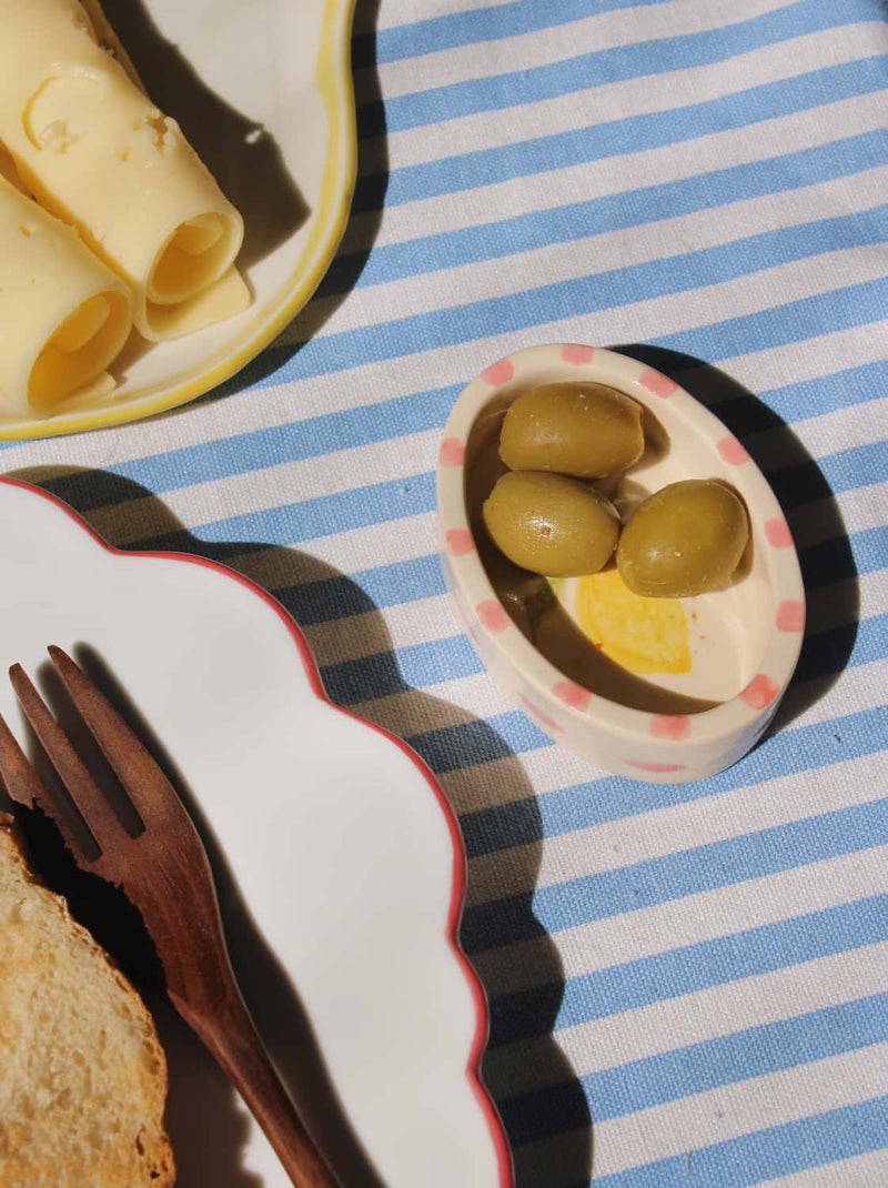 Limonetta ceramic trinket dish with lemon illustration styled on striped tablecloth