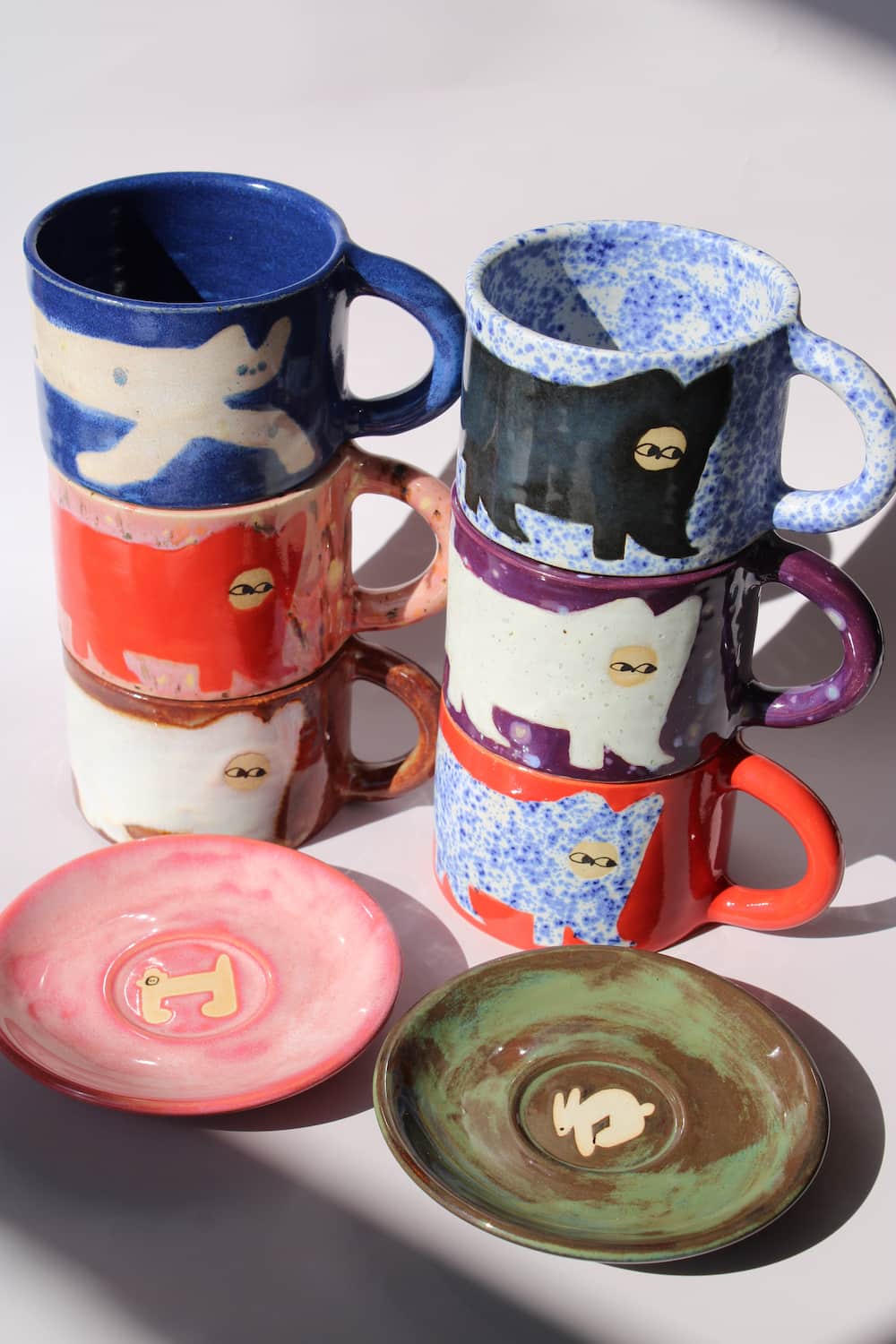 Handmade ceramics by Marta Shurpakova – colourful illustrated ceramic mugs and plates in playful designs and glazes
