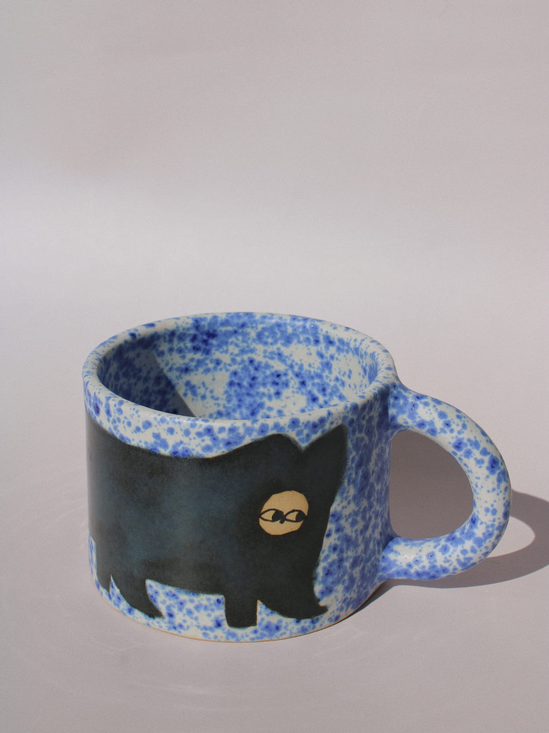 Midnight Cat Ceramic Mug by Marta Shurpakova – handmade blue ceramic mug with a hand-painted black cat design