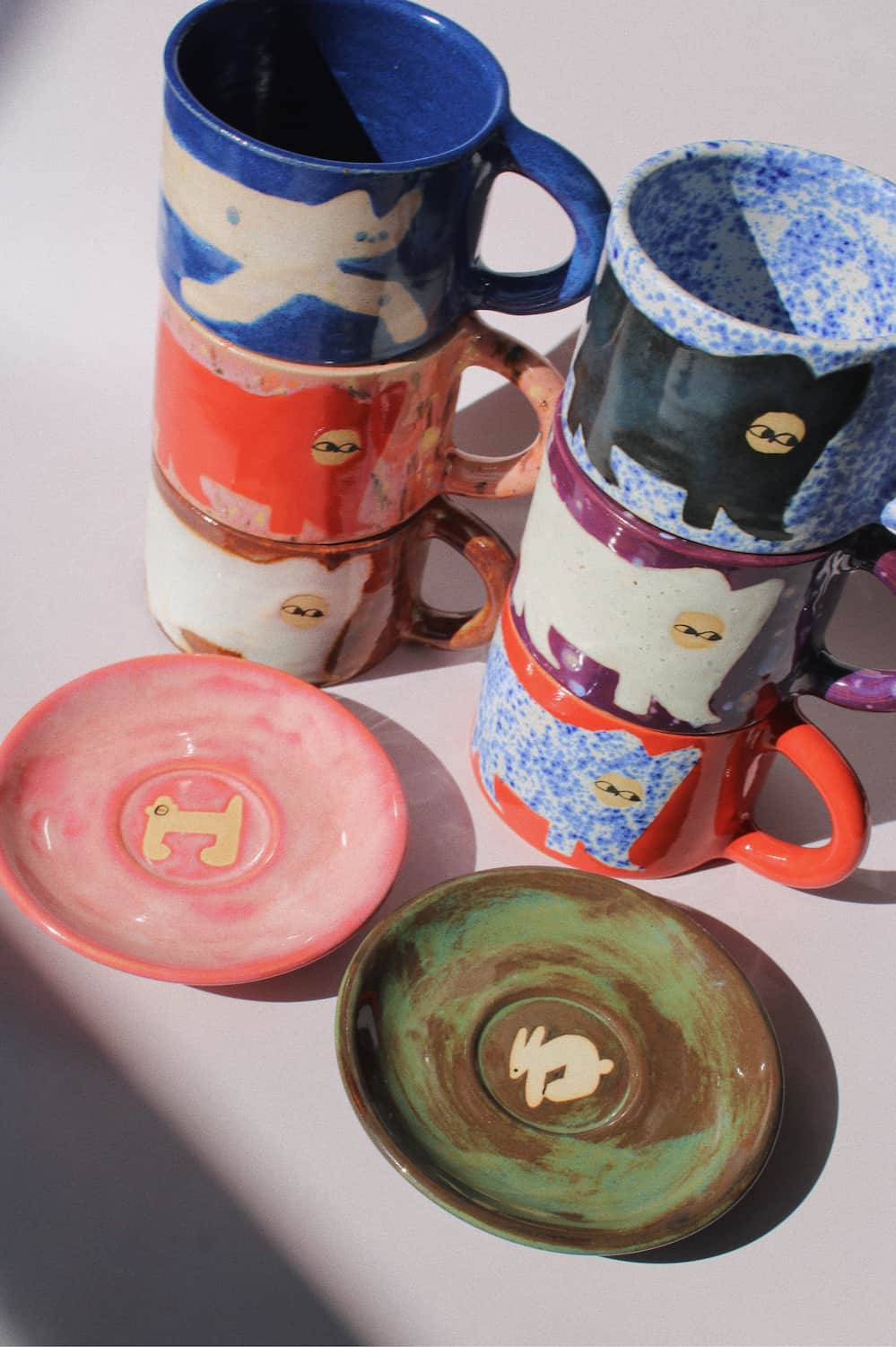 Handmade ceramics by Marta Shurpakova – colourful illustrated ceramic mugs and plates in playful designs and glazes