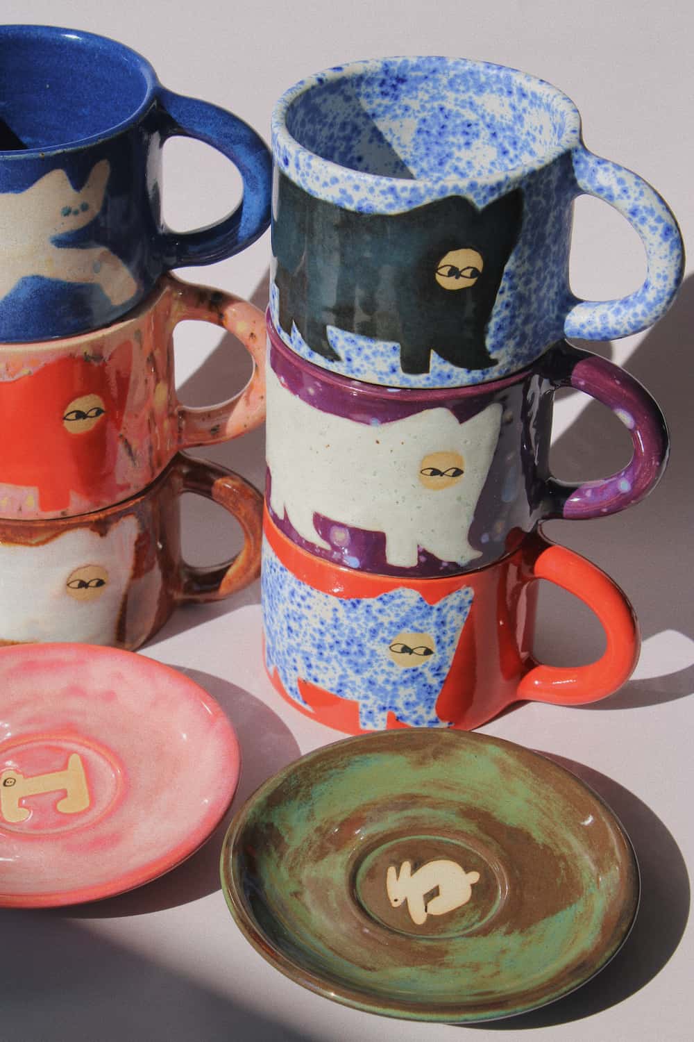 Handmade ceramics by Marta Shurpakova – colourful illustrated ceramic mugs and plates in playful designs and glazes