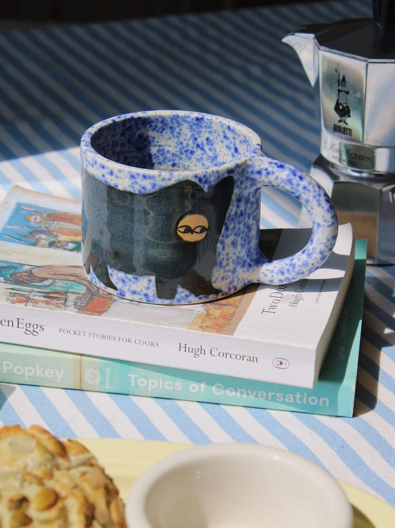 Midnight Ceramic Cat Mug by Marta Shurpakova – handmade black and blue ceramic mug with a playful cat design