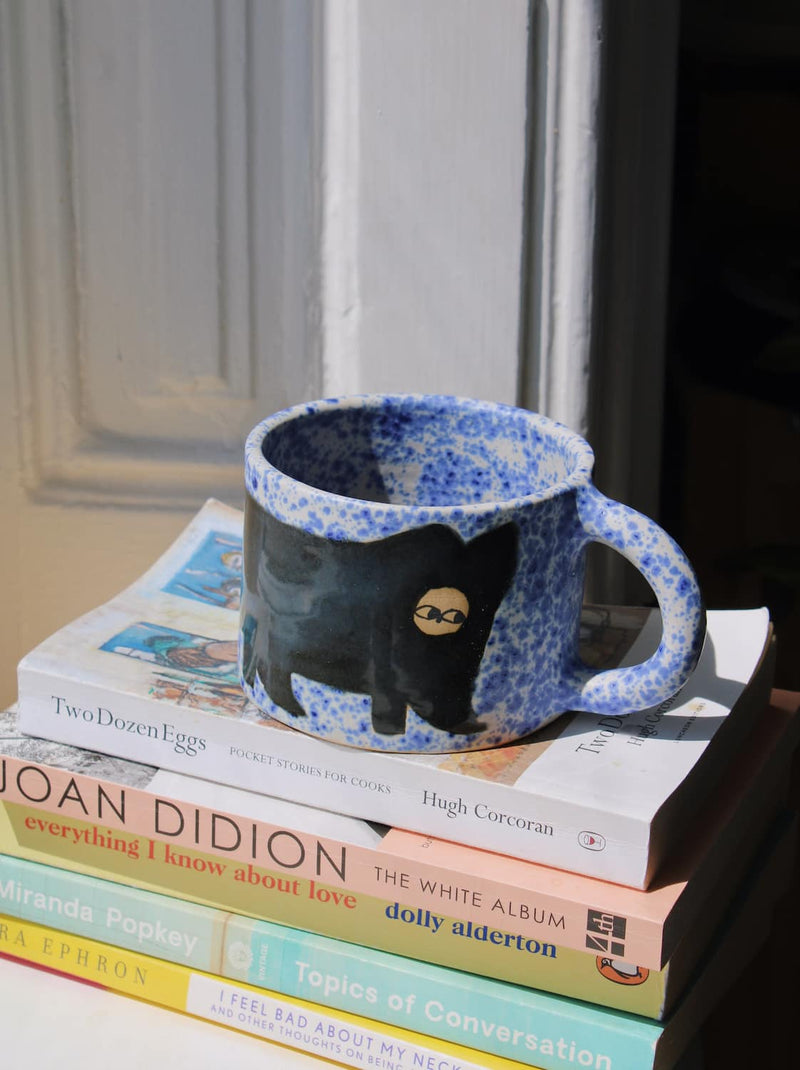 Midnight Ceramic Cat Mug by Marta Shurpakova – handmade black and blue ceramic mug with a playful cat design