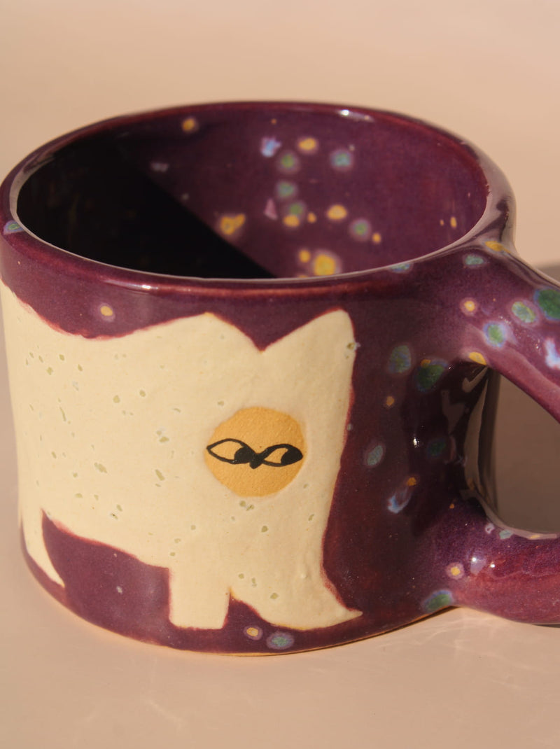 Mug with a cat design on a beige background